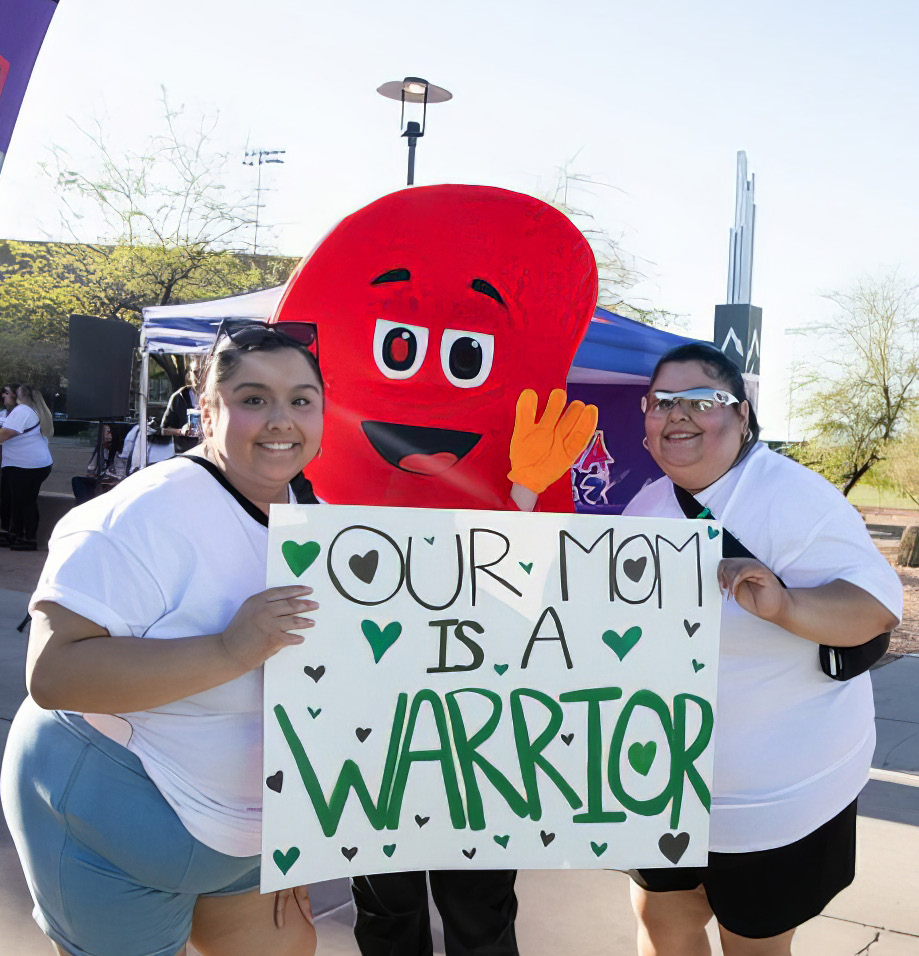 Two walkers honor their inspiration at the annual Phoenix Kidney Walk,
joined by mascot Sydney the Kidney.