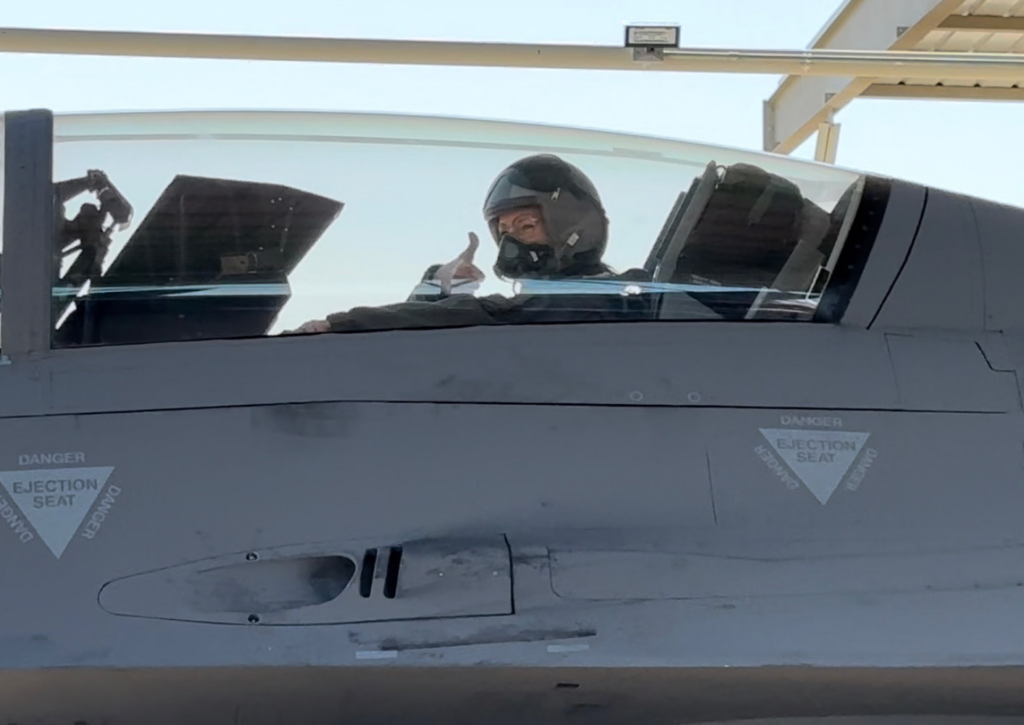 Hanks signals the ground crew before launching for a two-hour “dog fight” training exercise organized by Luke AFB.